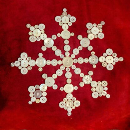 Red velvet pillow cushion with antique white pearl buttons